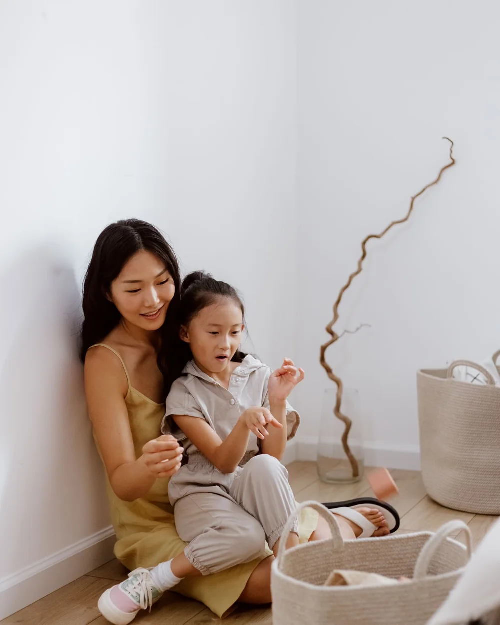 A mother and her daughter at home, sharing a quiet moment together